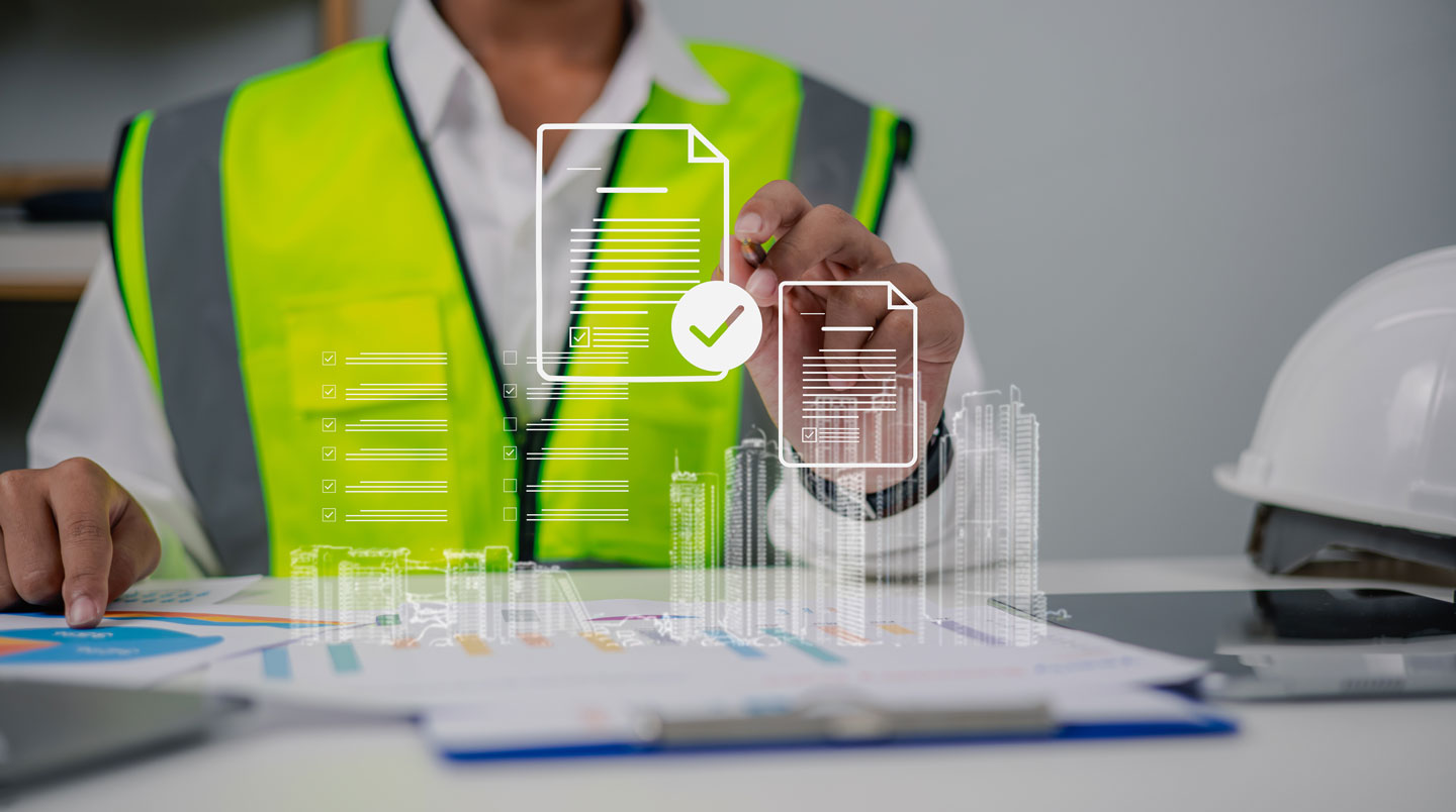 Attestation d'assurance décennale française posée sur table de travail entourée d'outils de construction authentiques